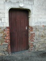 Mencas église portail.JPG